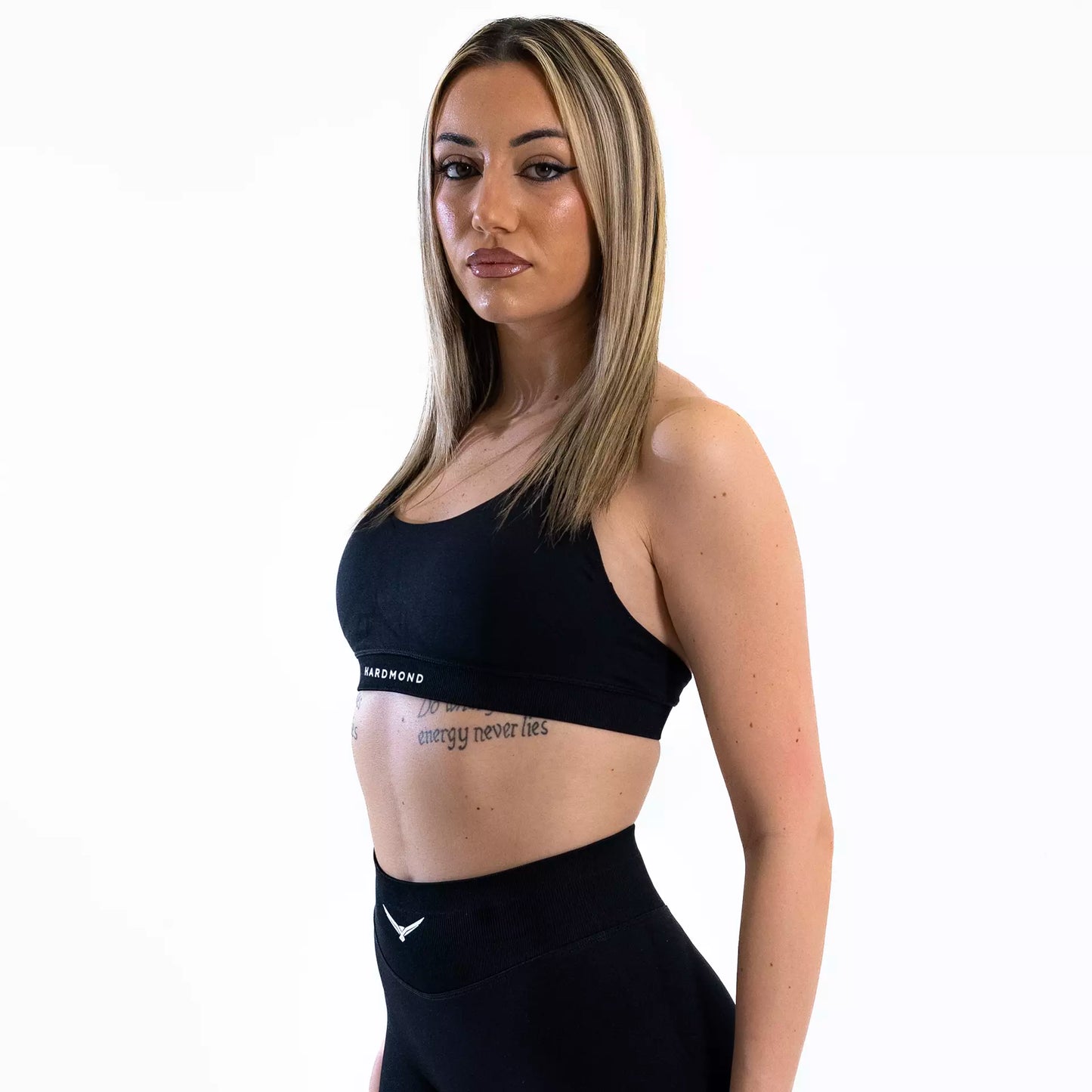 Model wearing HARDMOND Style Bra in black during workout