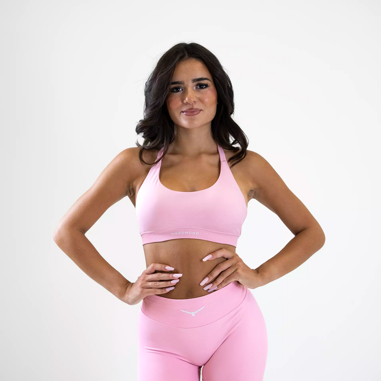 Model wearing HARDMOND Style Bra in pink during workout